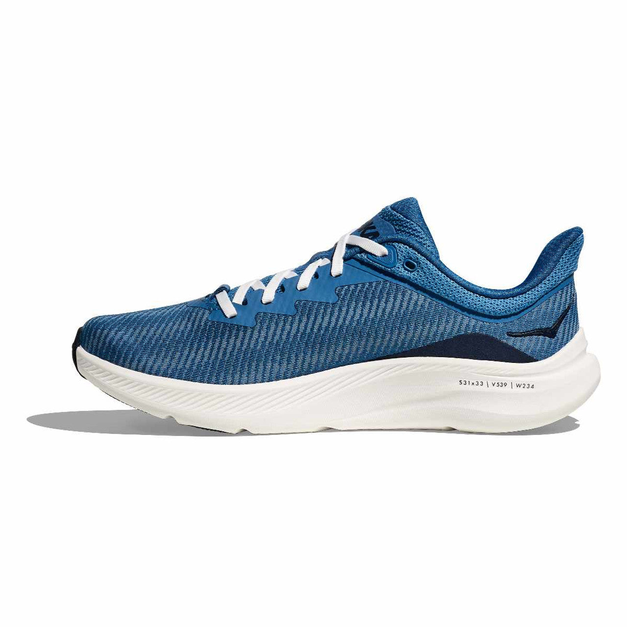 Blue running shoe with white sole on a white background