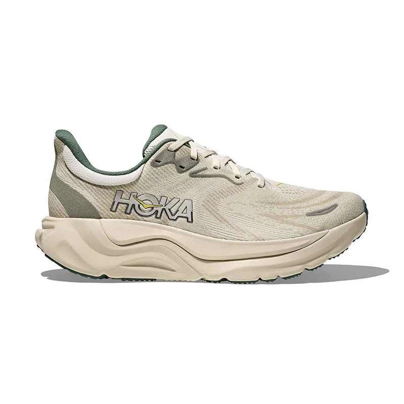 Beige running shoe with 'Hoka' branding on a white background